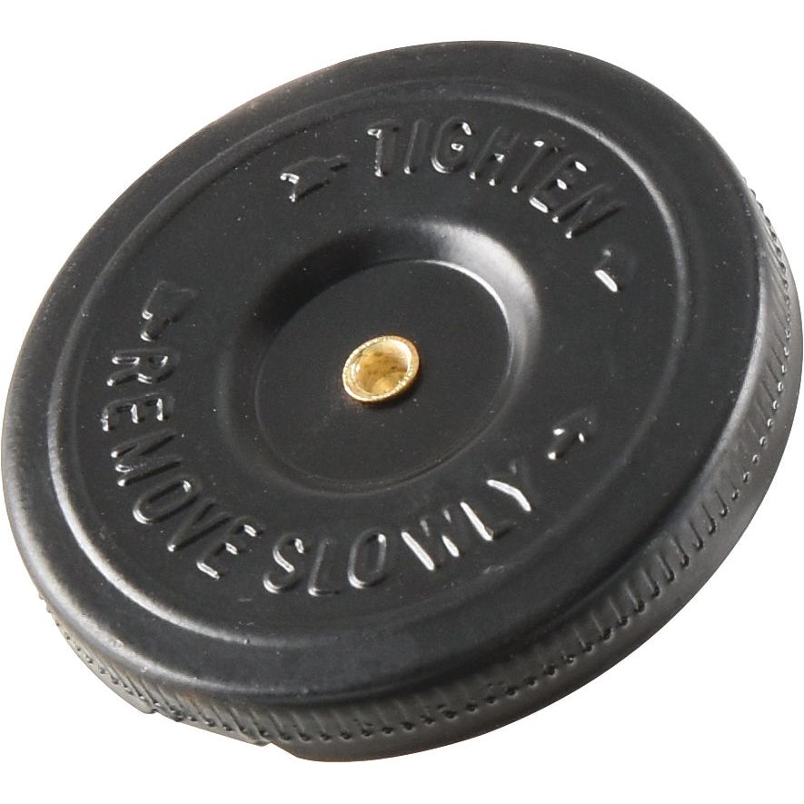 A circular black plastic Sparex Fuel Cap With Lock - S.65002, with the instructions "TIGHTEN" and "REMOVE SLOWLY" in raised letters, featuring a small brass-colored center point.