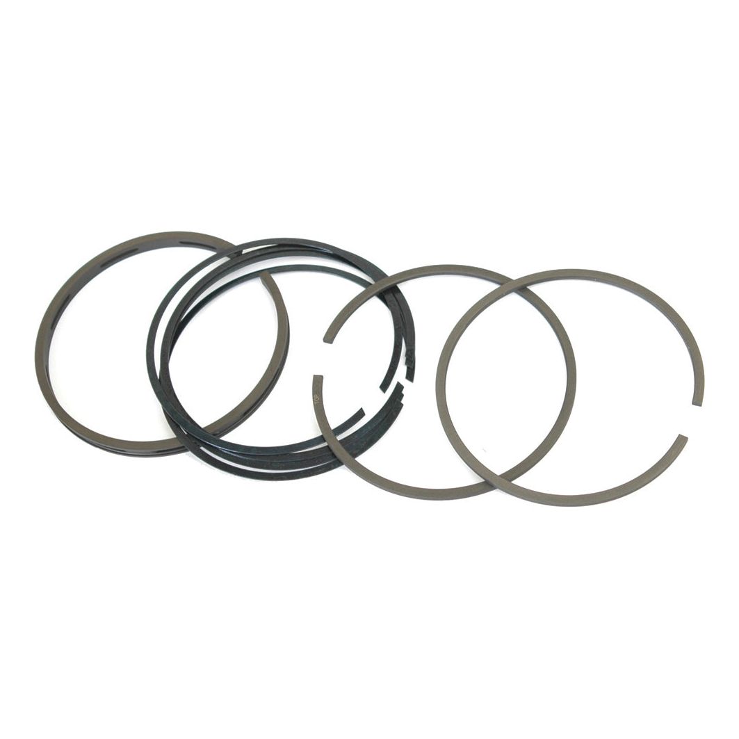 Image of five metal piston rings from the Sparex Piston Ring and Liner Kit (Sparex Part No. S.40429) arranged in a row, with some overlapping. The rings are circular with slight gaps and a dark color.