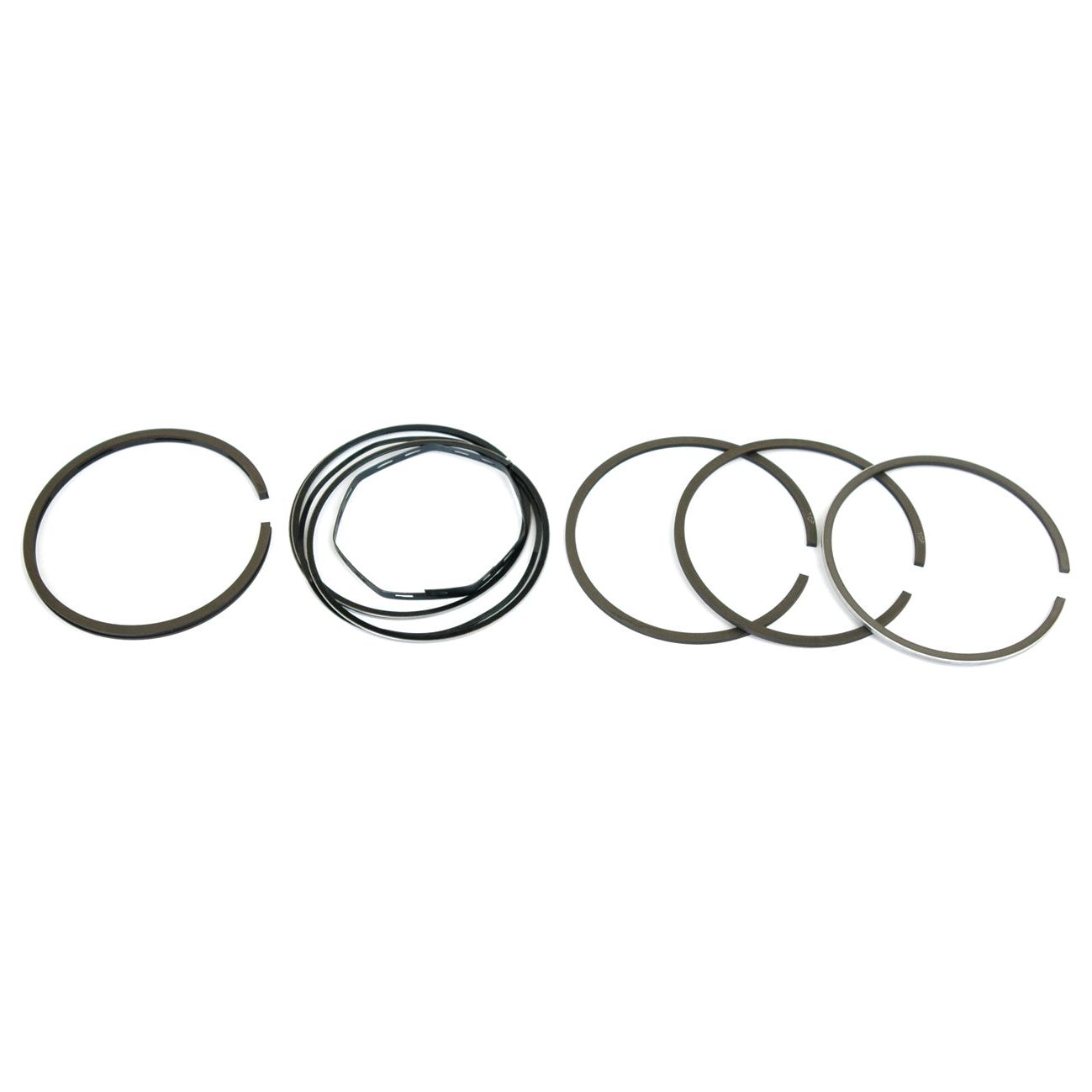 A set of chrome-plated engine piston rings, consisting of several concentric metal rings and a spring-like part, arranged in a row. This precision-engineered Piston Ring (Sparex Part No. S.42136) by Sparex is perfect for Massey Ferguson tractors.