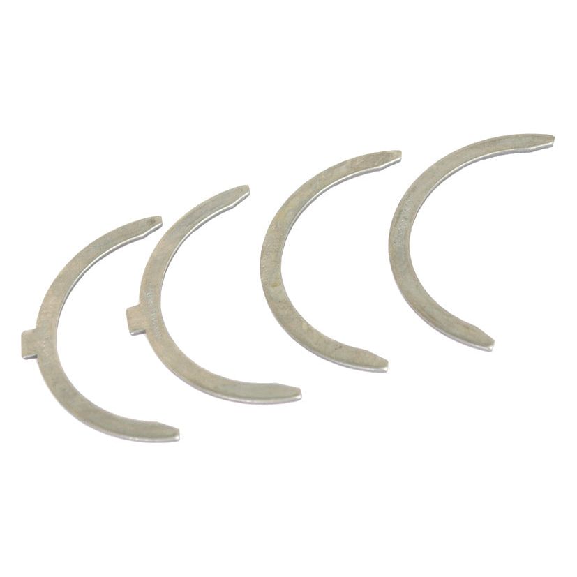 Four silver-colored, crescent-shaped metal washers from a Thrust Bearings Set (Sparex Part No.S.42365) by Sparex are arranged in a staggered formation on a white background.