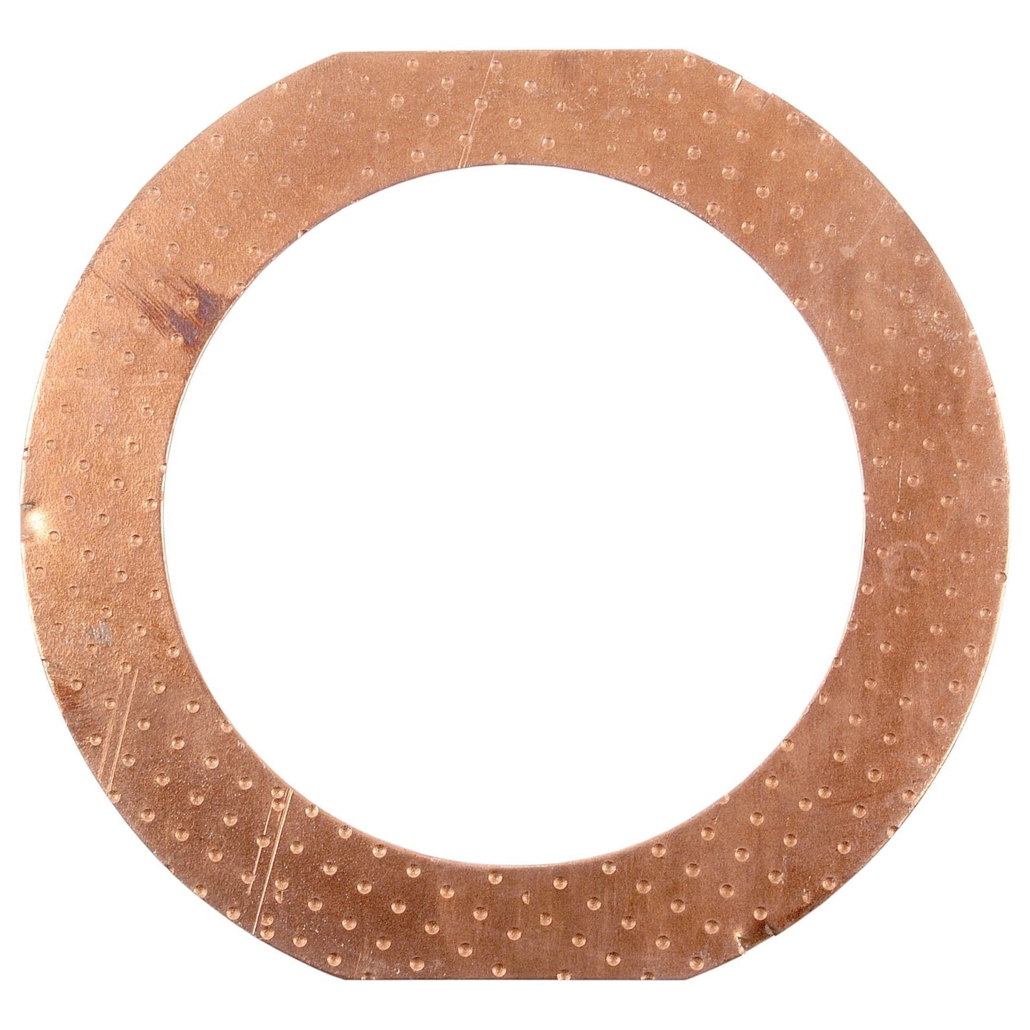 The Sparex Thrust Washer (Part No. S.41577) is a round, flat copper washer with a textured surface and notched edges, designed for use in Massey Ferguson reduction units when viewed from above.