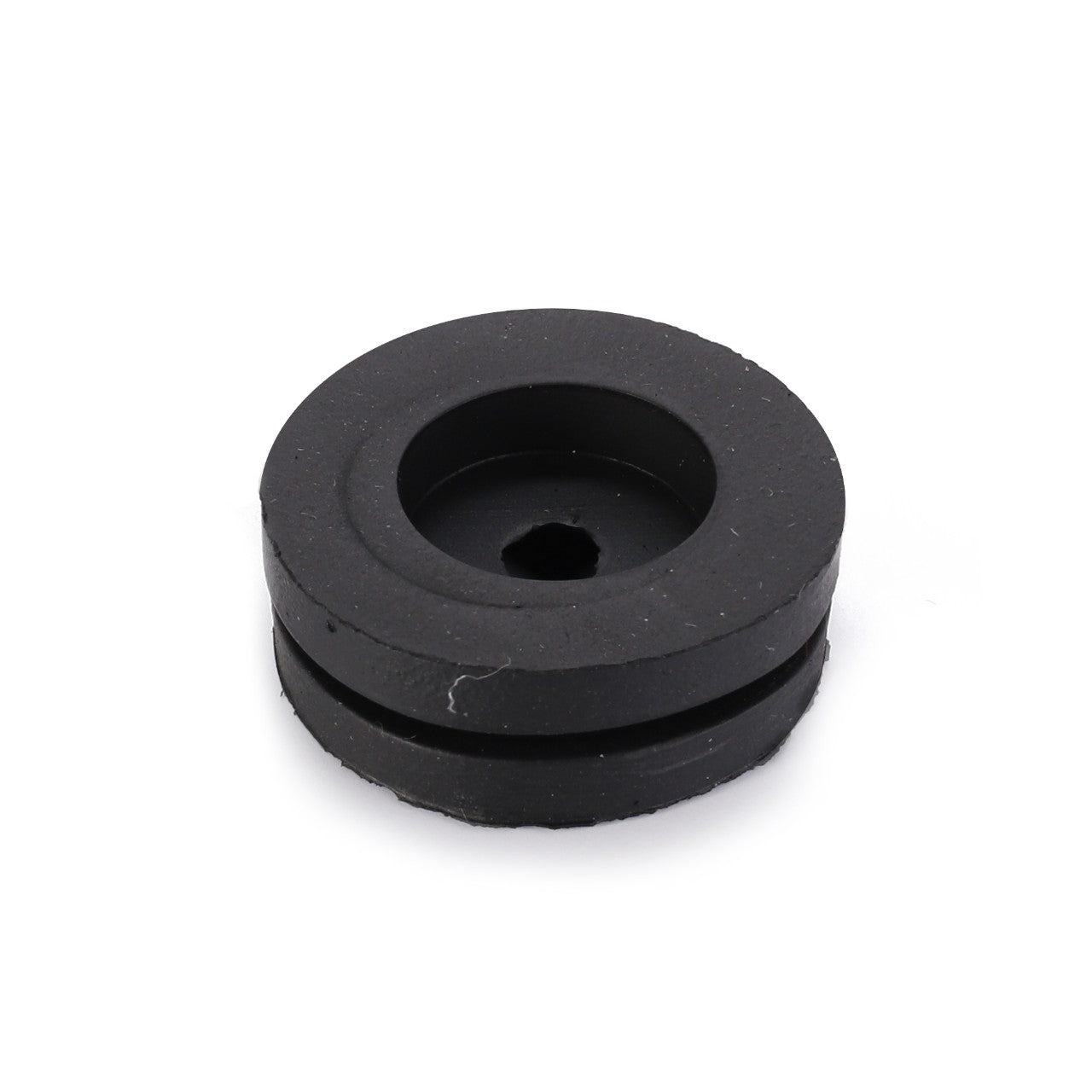 The AGCO Grommet (LA10397580) is a circular black rubber grommet featuring a central hole and a recessed groove around its edge, providing essential functionality.