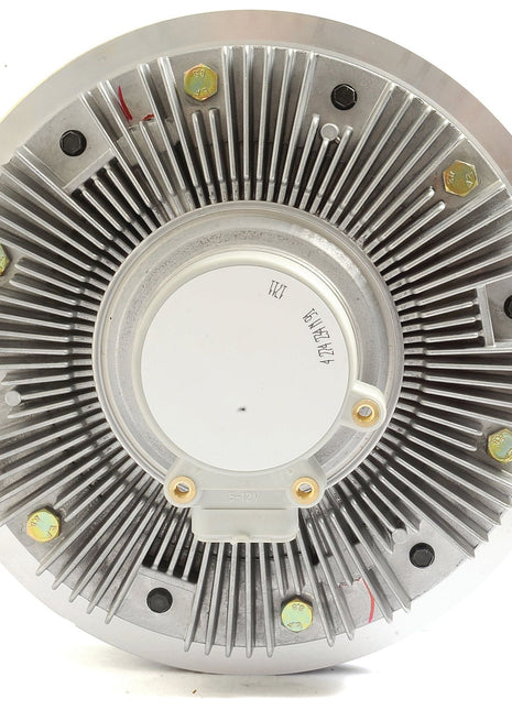 Close-up view of a circular metallic heat sink with a central white area, radial fins, and several bolts securing it—reminiscent of the robust design found in Sparex's Viscous Fan Drive (Part No. S.104709) for Massey Ferguson tractors.