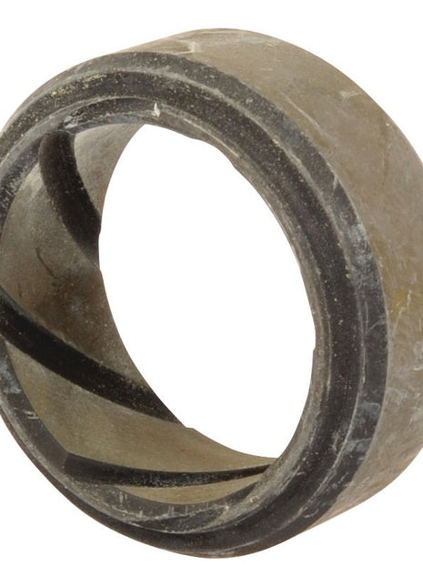 A close-up view of a round, metal bearing with a grooved inner surface, showing signs of usage and wear, resembling the durability seen in Sparex Upper Kingpin Bush (Sparex Part No.S.107241).