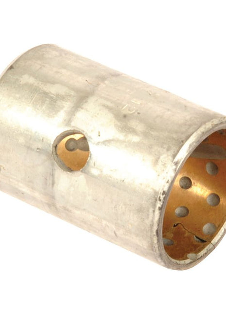 A cylindrical metal bushing with a perforated inner surface and a small hole on the outer surface, perfect for use as a Steering Arm Bush in your Massey Ferguson tractor. Introducing the Sparex Steering Arm Bush, Part No. S.107252.