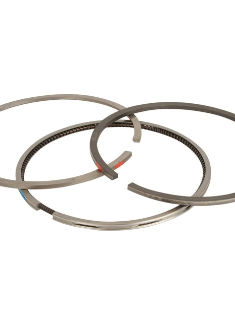 Three metal piston rings of varying sizes, displayed overlapping each other, perfect for a Landini 7830 or Massey Ferguson engine. Introducing the Piston Ring (Sparex Part No.S.107290) from Sparex.