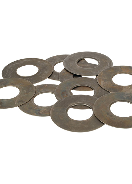 A collection of large, round metal washers with central holes, seemingly made of steel with a slightly tarnished surface. These are likely Hydraulic Pump Washers (Sparex Part No. S.107358), designed for use in Massey Ferguson machinery's hydraulic pump washer systems by Sparex.