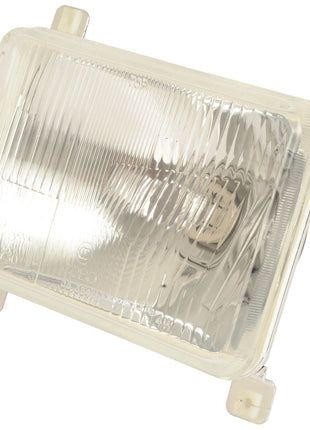 The Head Light, (Halogen), RH & LH, LH Dip, 12V – S.107396 from Sparex features a clear, ribbed lens and mounting brackets at each corner, perfectly accommodating a Sparex bulb.