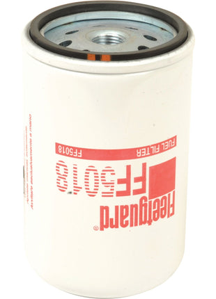 A white cylindrical fuel filter labeled "Sparex" and "FF5018." The top of the Sparex fuel filter shows several holes for fitting.