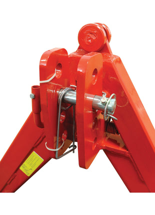 Close-up of the A Frame Quick Hitch System (Cat.1) CE Approved - S.110168 by Sparex, showcasing its heavy-duty red metal hinge mechanism with pins and bolts, used in large machinery or equipment. Load capacity: 1200Kg.