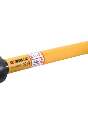 A GARDLOC PTO Shaft by Sparex, featuring a yellow body with black protective coverings on both ends, various labels, safety warnings, and the dependable GARDLOC Clutch for enhanced protection. It measures 1010mm in length and has a 1 3/8'' x 6 Spline Q.R. to 1 3/8'' x 6 Spline Ratchet Clutch (Sparex Part Number: S.128693).