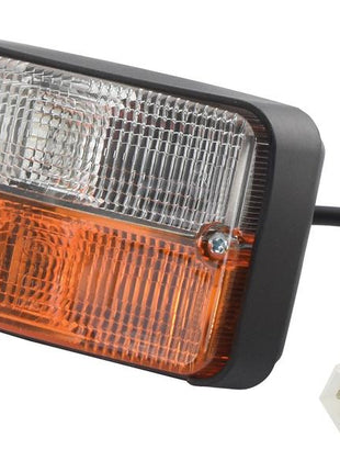 A Sparex brand Indicator Light, featuring a rectangular vehicle light assembly with a clear top and amber bottom section, attached to a black cable and white connector plug. This halogen light is compatible with both RH & LH orientations and operates on 12V (Sparex Part Number: S.151743).