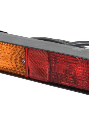 The Sparex Rear Combination Light (Halogen), featuring two orange and two red lens panels housed in black plastic with visible electrical wiring at the rear, is designed to ensure safety and visibility with its 3-function brake, tail, and indicator lights. Operating at 12V, it is cataloged under Sparex Part Number S.160697.