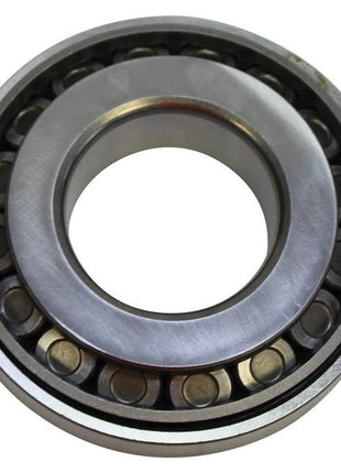 Close-up of the Sparex Taper Roller Bearing (4T-55200C/55437), featuring an inner and outer ring encasing cylindrical rollers; primarily used to reduce friction in rotating mechanical parts. Sparex Part Number: S.166839.