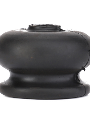 A well-used black rubber grommet with a cylindrical shape and central hole, ideal for various tractor parts in Pre-100 Series models, the Massey Ferguson Boot Slave Cylinder (Model 183462M1) from AGCO.