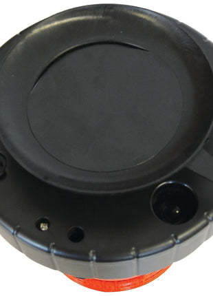 A top view of the LED Rechargeable Beacon (Amber) by Sparex NLA showcasing its black, round design with a red circular base, multiple connectors and screws visible on its surface, and an integrated LED light.