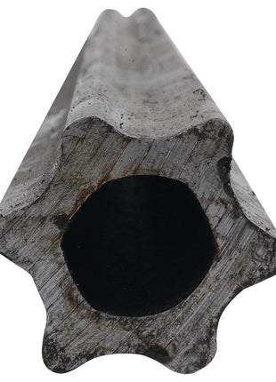 Close-up view of a roughly worn Sparex PTO Tube - Star Profile, Length: 1M (S4) - S.24820, showcasing its hollow, star-shaped metal cylinder with a dark central opening.