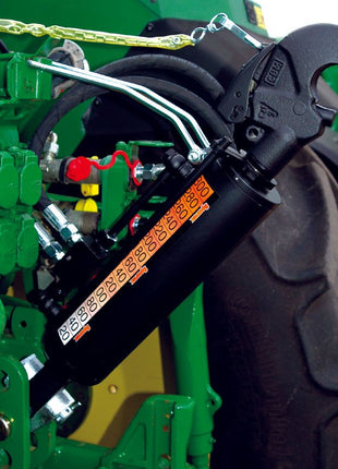 Close-up of the Sparex Hydraulic Top Link (Cat.3/3) Knuckle and Q.R CBM Hook, part of the tractor end hitch mechanism, used for adjusting the attached equipment's angle. The surrounding metal components, including the hose set, are painted green and black. Model details: Cylinder Bore - 90mm, Min Length - 650mm (Sparex Part No.S.331201).