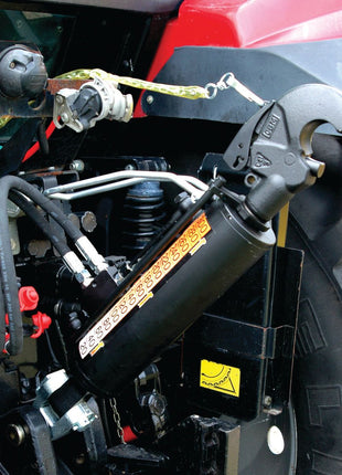 A close-up of a mechanical part, featuring hydraulic connections and levers on heavy machinery, prominently showcases the Sparex Hydraulic Top Link (Cat.2/3) Knuckle and Q.R CBM Hook with a 90mm cylinder bore and a minimum length of 690mm. The red-and-black metal casing in the background hints at the tractor end, complementing the robust design of this component.