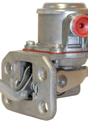 Close-up of a Fuel Lift Pump | Sparex Part No.S.40563 with a silver metallic body and a red inlet port, commonly used in automotive engines, such as the Perkins A4.212 or Allis Chalmers 170 by the brand Sparex.