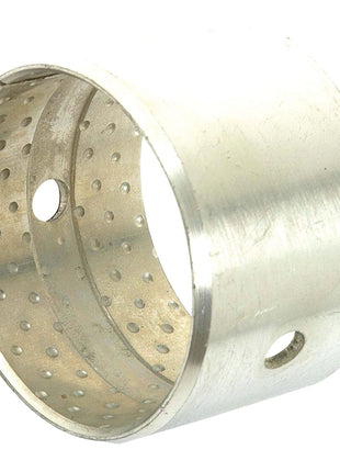 The Axle Pivot Pin Bush - S.41758 by Sparex is a cylindrical metal bushing featuring two circular holes and multiple small perforations around its surface, meticulously designed to achieve precise ID and OD dimensions.