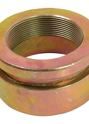 The Sparex Seal Retainer Housing (Part No. S.41989) is a metal hex nut with a large central threaded hole, featuring a yellowish-gold tone, visible threading, and slight surface wear that resembles parts found in Massey Ferguson machinery.