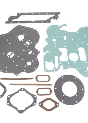 A collection of AGCO Massey Ferguson Sump Gasket Kit (part number 4224142M91) components arranged on a white background. The gaskets come in various shapes and sizes, crafted from different materials, essential for maintaining your Massey Ferguson tractor parts.