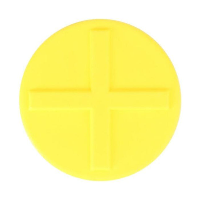 A round, yellow object with a raised plus sign in the center, reminiscent of the precision seen in AGCO's Massey Ferguson model 4270218M1 padding.
