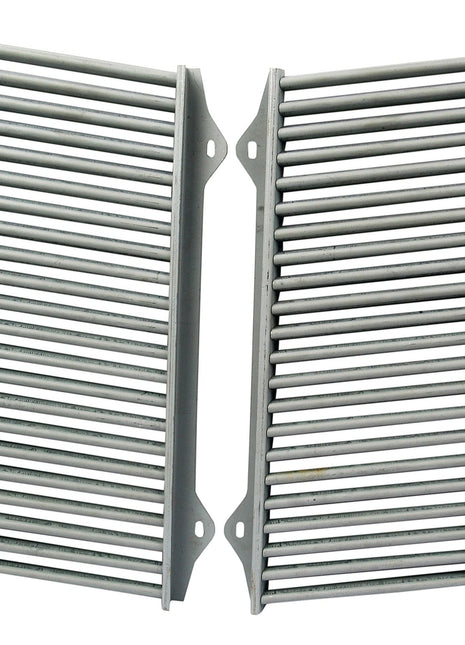 Two grey metal grill grates with parallel bars are placed side by side. Each grate, which is part of the durable Front Grille set (Sparex Part No.S.42914), has mounting holes at the four corners, making it suitable for Massey Ferguson and Landini tractors. This product is from the Sparex brand.