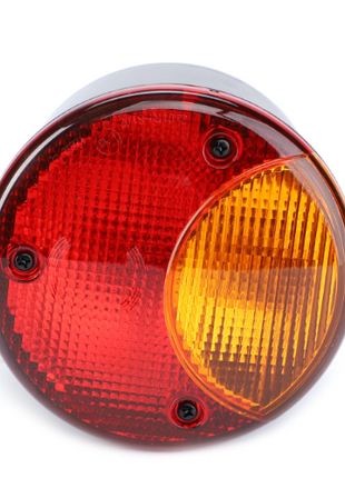 A round, two-tone vehicle tail light with red and amber sections, secured by four black screws, perfect for the Massey Ferguson 6400 Series, is available as the AGCO Massey Ferguson Rear Light L/H - 4295458M2.