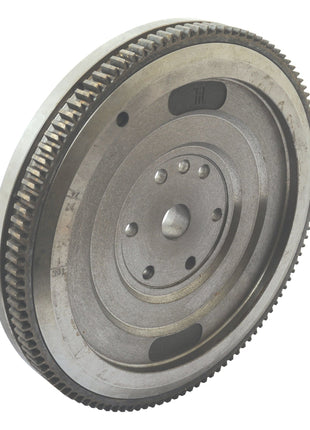 Close-up of the Flywheel Assembly 13'' (Sparex Part No.S.43788) from Sparex, featuring gear teeth and circular patterns with center holes for attachment, reminiscent of components found in classic Landini tractors.