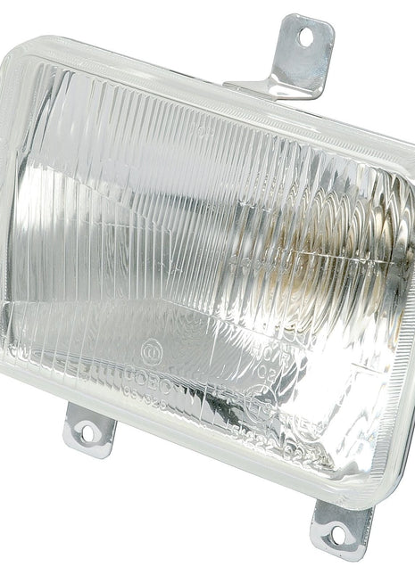 The Sparex Head Light (Halogen), RH & LH, LH Dip, 12V - S.43904 features a rectangular design with a clear, ribbed lens. It includes two mounting brackets on the top and one on the bottom. This headlight is IP65 rated for durability and performance in harsh conditions.
