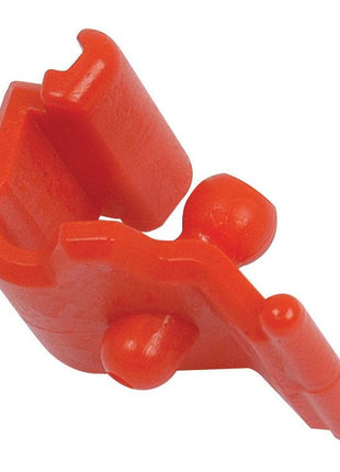 Close-up of a Sparex red plastic clamp, part number S.56509, with a simple, angular design featuring two small protruding knobs, a rectangular opening, and the reliable PTO GREASE NIPPLE LOCK mechanism.