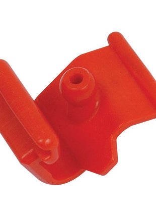 A Sparex PTO Grease Nipple Lock (Sparex Part No. S.56509) featuring a red clamp made of plastic, with a central hole and two flat, parallel extensions on either side.