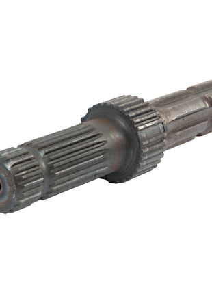 Close-up of the Sparex PTO Shaft - S.58865 spinning at 540/1000 RPM, showing grooves and ridges along its cylindrical metal body.