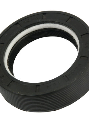 Close-up of a Sparex oil seal, part number S.65359, measuring 141 x 120 x 11.3mm, featuring black rubber construction and a metal spring inside, designed to prevent leakage of lubricants in Ford/New Holland machinery.