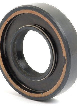 The Imperial Rotary Shaft Seal, Sparex Part No. S.65681, measures 1 3/4'' x 3 1/2'' x 3/4''. It is a dark-colored, circular seal with a metallic spring on its inner edge and is used in machinery to prevent leakage. This seal is compatible with Ford New Holland equipment and belongs to the Sparex brand.