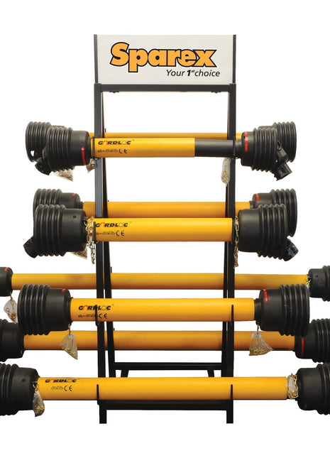 Sparex PTO Shaft Display Stand, model S.7559, featuring eight yellow shafts arranged horizontally. Above the rack, a sign proclaims: "Sparex Your 1st choice" for hydraulic top links and more.