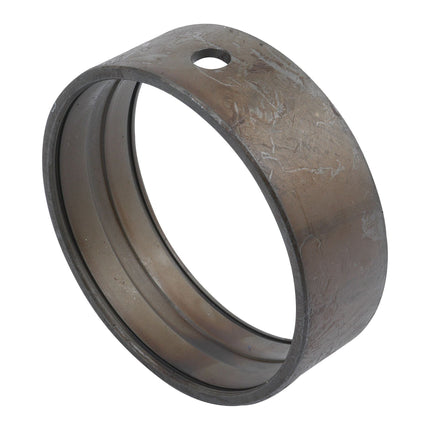 A slightly worn and scratched Sparex metal cylindrical bearing, featuring a hole on one side, suitable for Case IH Spindle Bush applications, known as the Spindle Bush | Sparex Part No.S.7721.