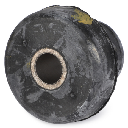 A worn, round metal object with a central hole and a weathered, dark exterior, likely the AGCO Massey Ferguson Cab Mounting - 1612171M1 from the vintage 200 Series tractor parts.