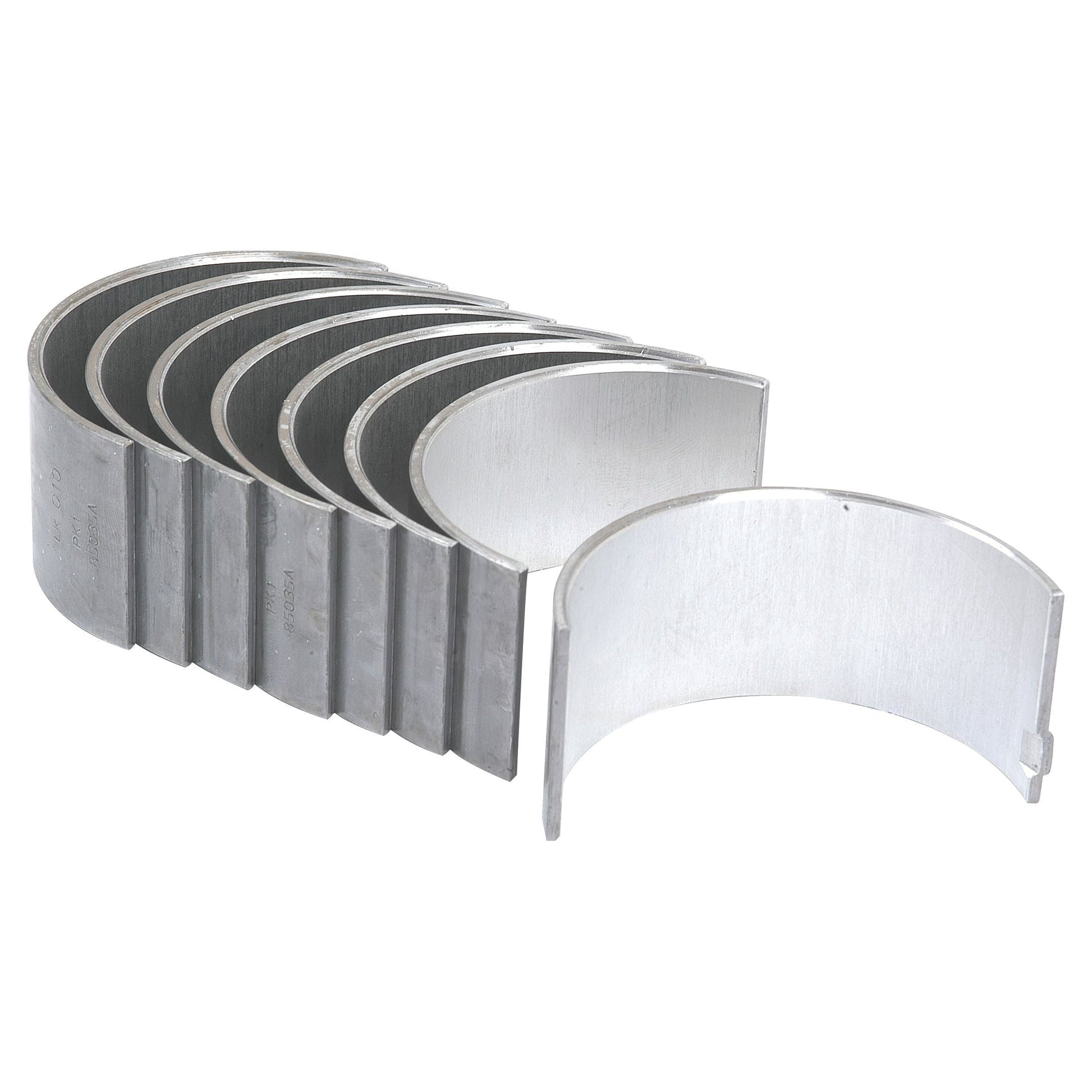 A set of seven Sparex Conrod Bearing +0.010'' (0.25mm) engine bearings, ideal for Perkins engines or Massey Ferguson tractors, are arranged in a row with one bearing positioned in front to showcase its concave side. (Sparex Part No.S.40320).