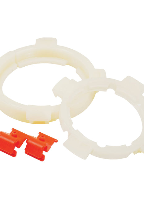 Two white plastic EASYLOCK B/RINGS WEASLER A8W/A and two red plastic clamps are placed on a white background, demonstrating the practical simplicity of Sparex's PTO EasyLock Bearing Rings (Sparex Part No.S.26362).
