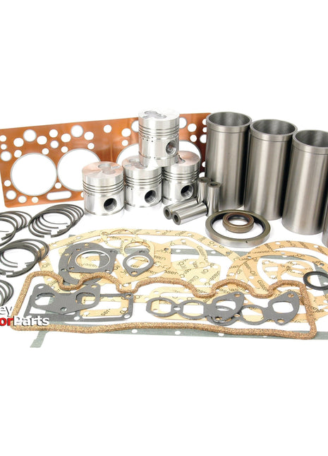 An array of tractor engine parts, including pistons, liners, seals, gaskets, and other components from the Engine Overhaul Kit without Valve Train (Finished) - S.41945 by Sparex are arranged on a white background. The "Massey Tractor Parts" logo is visible in the corner alongside components for the Perkins Engine.