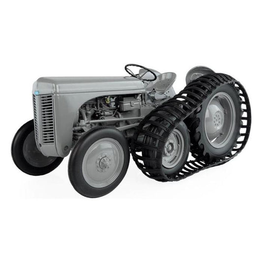 A gray Massey Ferguson - Ferguson TEA 20 with Half-Track (X993040417101) by AGCO, featuring a large continuous track instead of the rear wheels and standard front wheels, is displayed against a plain white background, making it a true collectible.