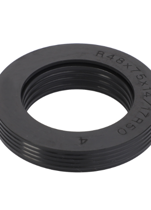 A black circular rubber gasket with grooves around the outer edge and an inner diameter slightly smaller than its outer diameter, ideal for use in Massey Ferguson 7400 Series tractor parts, is available as the AGCO product Massey Ferguson Front Axle Seal VA339592.