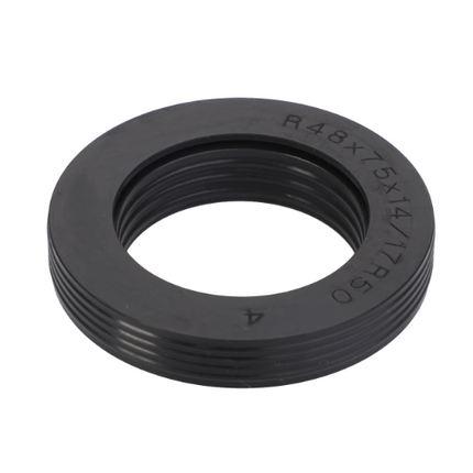 A black circular rubber gasket with grooves around the outer edge and an inner diameter slightly smaller than its outer diameter, ideal for use in Massey Ferguson 7400 Series tractor parts, is available as the AGCO product Massey Ferguson Front Axle Seal VA339592.