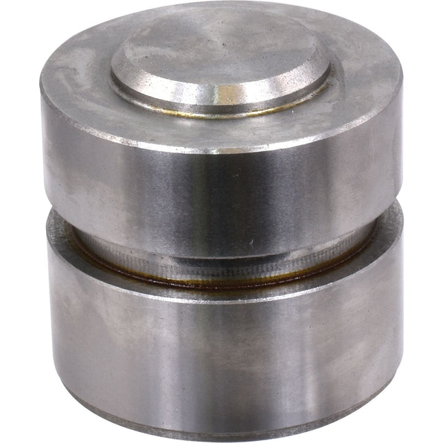 A cylindrical metal object with a smaller raised cylinder on top, featuring a central groove dividing the main body. The surface appears polished and metallic, resembling the Sparex Hydraulic Cylinder Piston (Part No. S.67816).