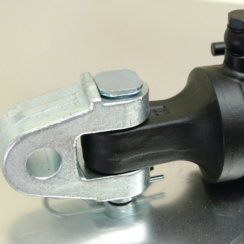Close-up of a Sparex Hydraulic Top Link (Cat.28mm/3) Knuckle and Q.R CBM Hook, featuring an 80mm cylinder bore and resting on a reflective surface, showcasing its heavy-duty mechanical joint with hinge and clamp components.