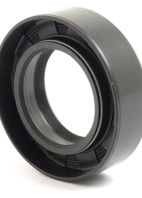 A black rubber oil seal with a circular shape, like the Sparex Imperial Rotary Shaft Seal (Sparex Part No. S.65670, dimensions 1 1/2'' x 2 1/2'' x 3/8''), used to seal the entry point of rotating shafts in Ford New Holland machinery to prevent the leakage of lubricants.