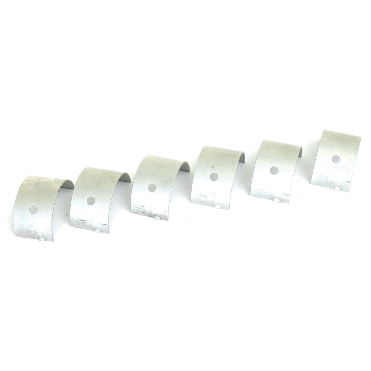 A set of six curved, metallic components with diagonally arranged holes on a white background, reminiscent of high-quality Massey Ferguson parts, known as the Main Bearing +0.020'' (0.50mm) (Set), Sparex Part No. S.42364 by Sparex.